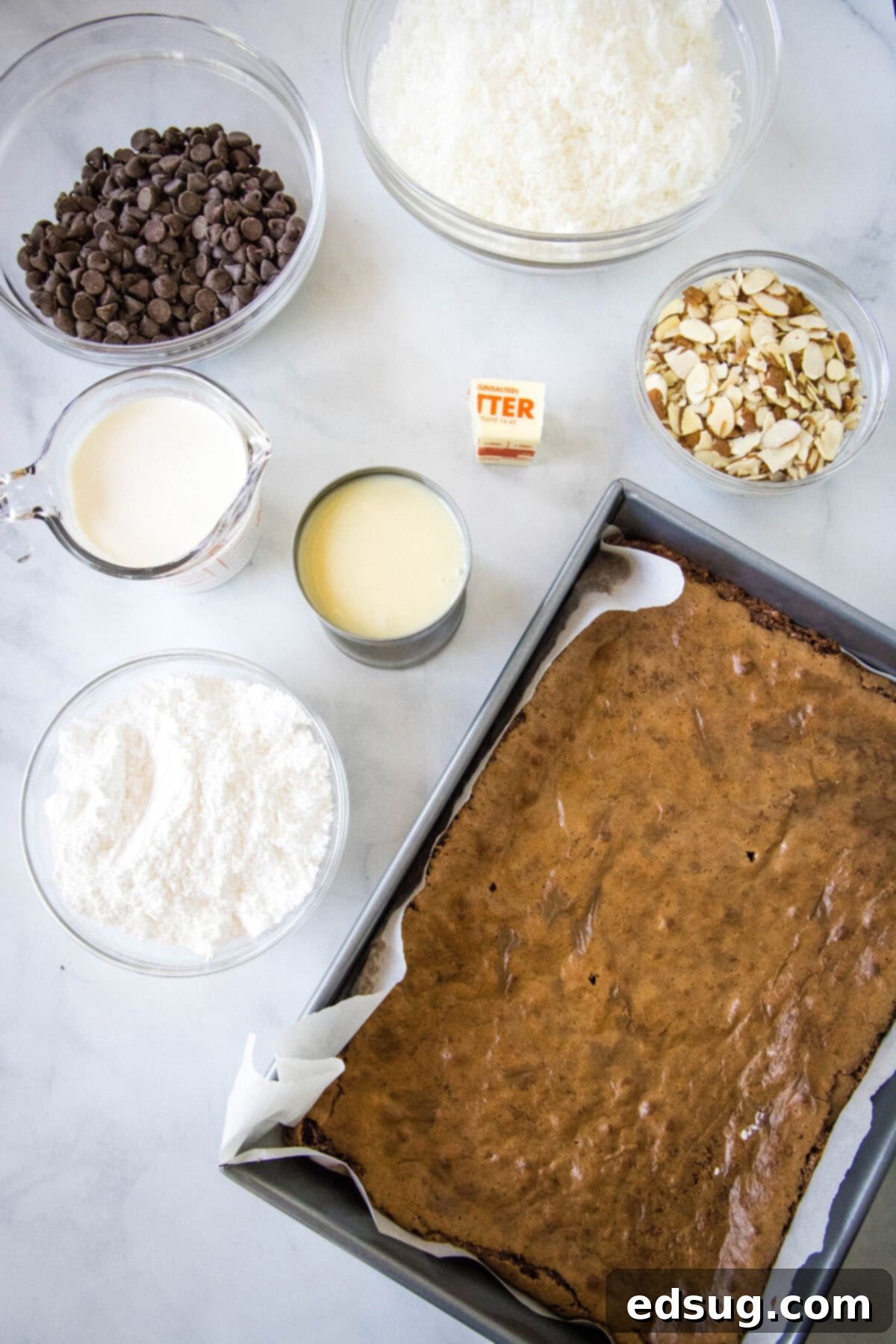 Ultimate Almond Joy Brownies 3 ingredients for almond joy brownies laid out on a table