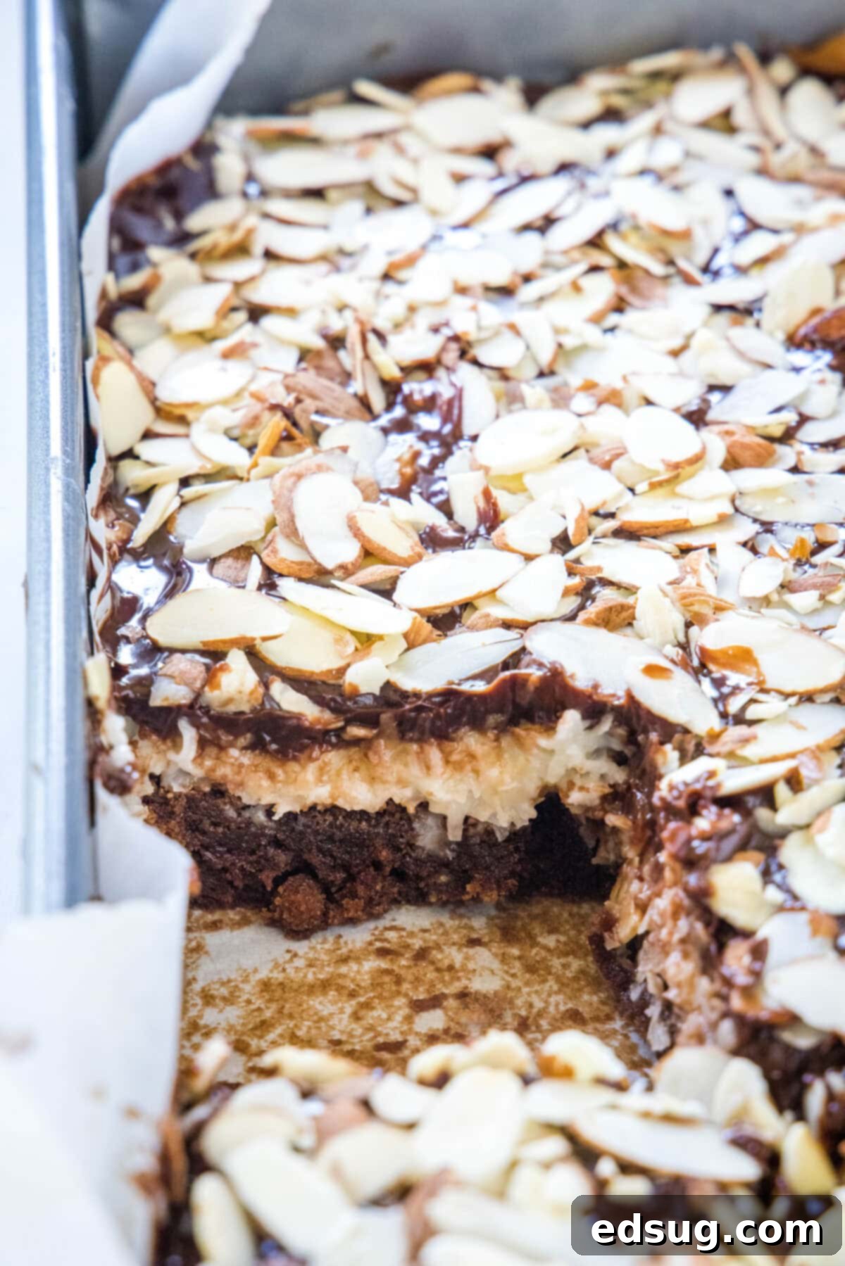 Ultimate Almond Joy Brownies 5 close up view of almond joy brownies in a baking pan