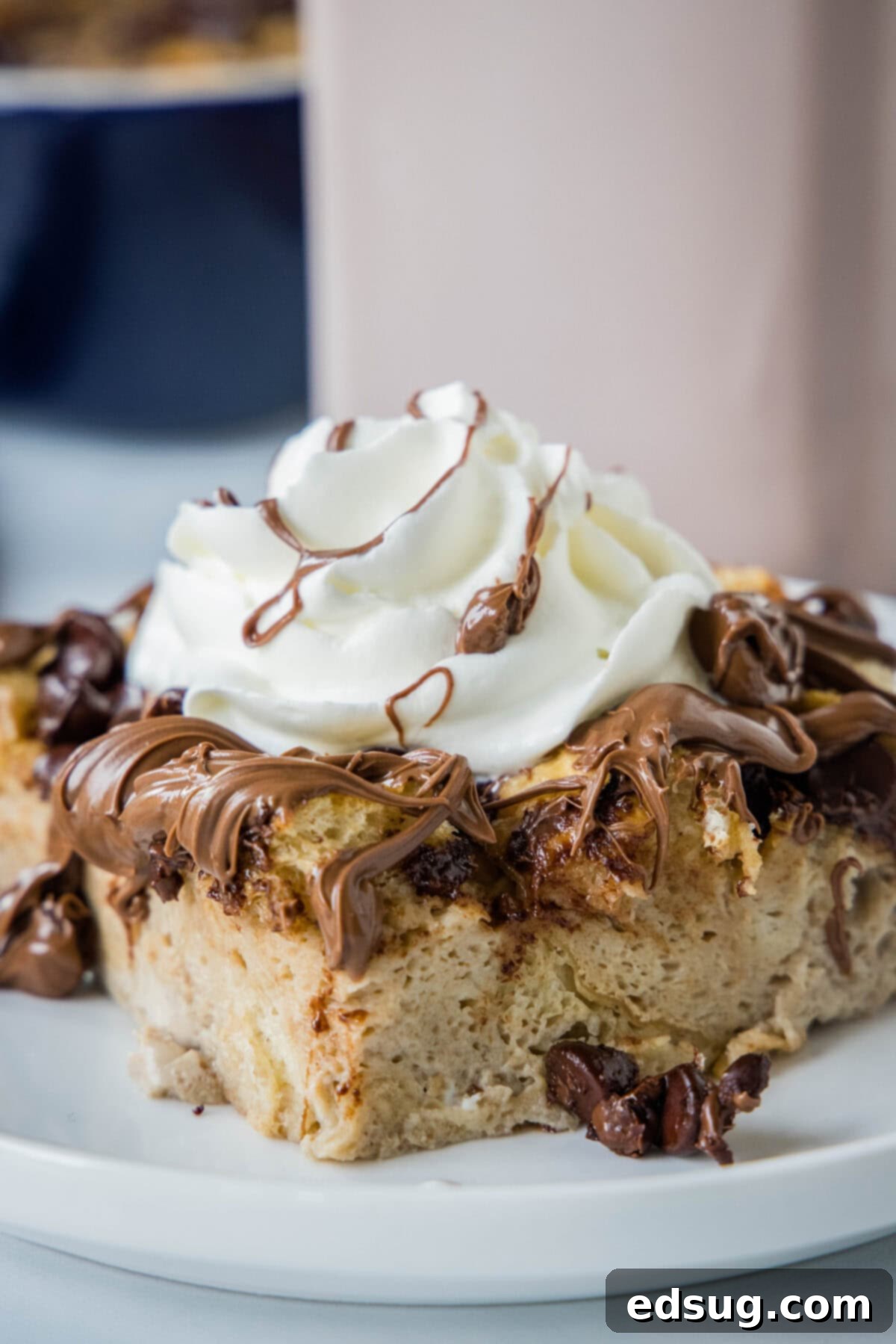 Decadent Chocolate French Toast Bake 2 chocolate french toast bake n a plate topped with whipped cream