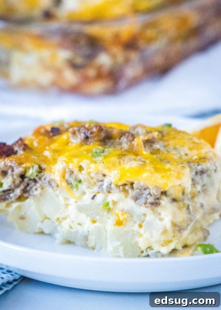 Sliced Sausage Breakfast Casserole on a plate with fresh parsley