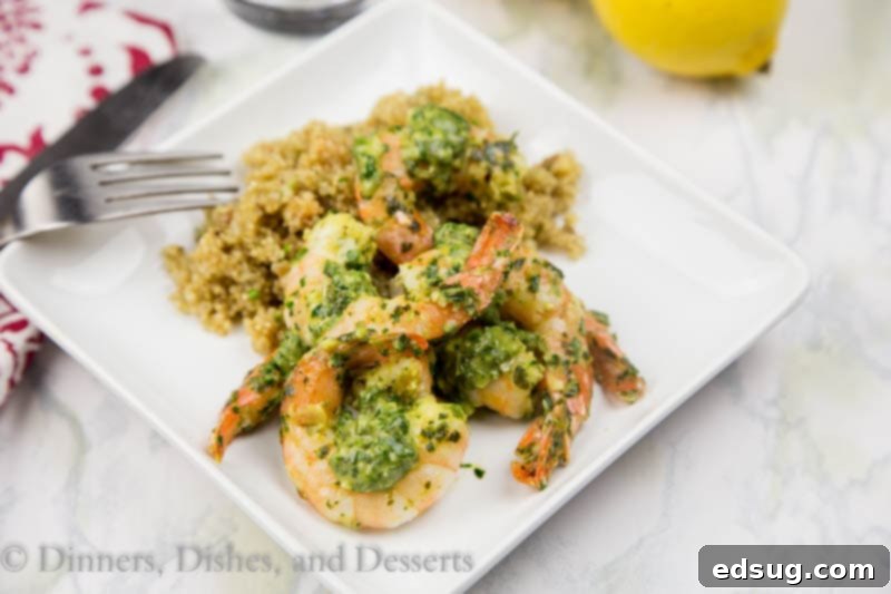 Sizzling Herb Shrimp 3 Herb pan seared shrimp served on a white plate with fresh herbs