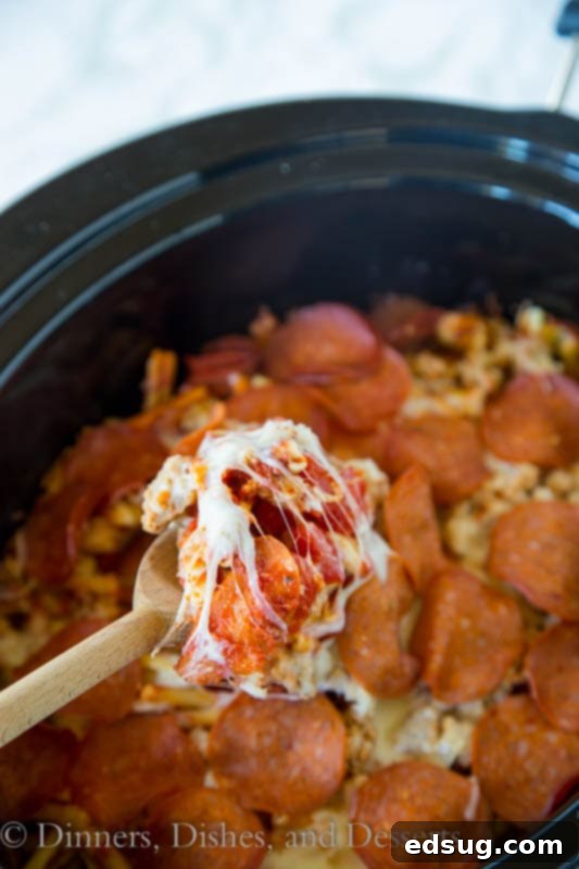 One Pot Pizza Wonder 2 slow cooker pizza pasta in a slow cooker, bubbling with cheese and pepperoni