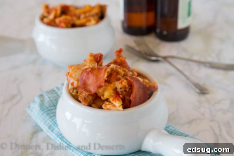 One Pot Pizza Wonder 3 slow cooker pizza pasta in a bowl, showing melted cheese and pepperoni