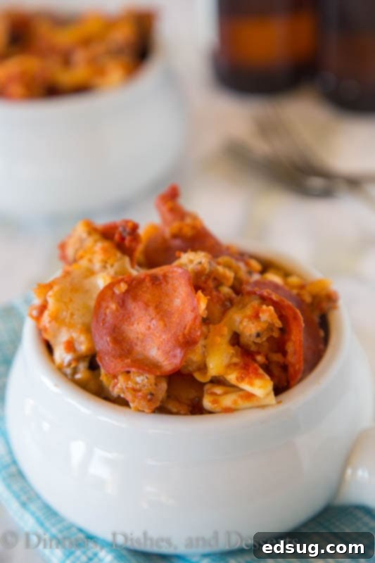 One Pot Pizza Wonder 4 close-up of slow cooker pizza pasta in a bowl, showing texture and melted cheese