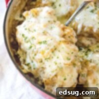 close up taking a pork chops out of the pan