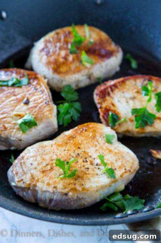 Savory Lemon Garlic Pork Chops 2 Skillet of perfectly seared lemon garlic pork chops