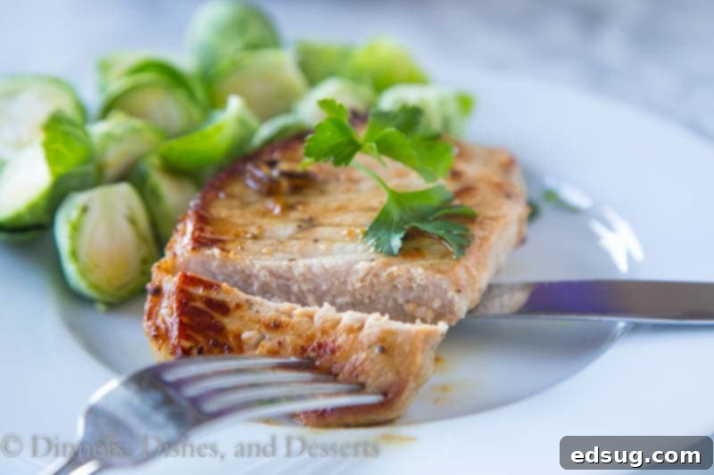 Savory Lemon Garlic Pork Chops 3 Sliced lemon garlic pork chop revealing juicy interior