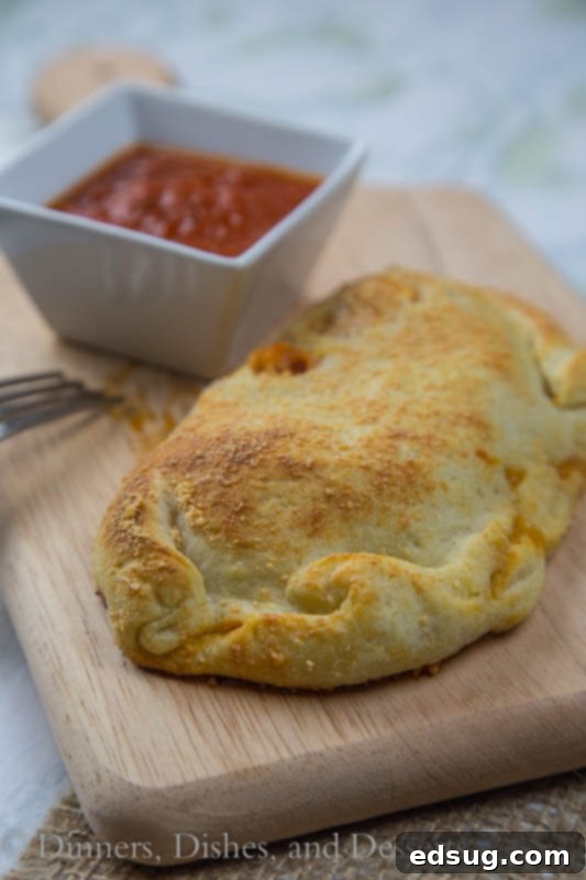 Ultimate Chicken Parmesan Calzones 2 chicken calzone on a plate