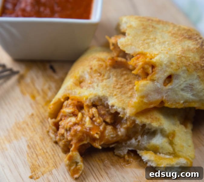 Ultimate Chicken Parmesan Calzones 3 chicken calzone on a plate