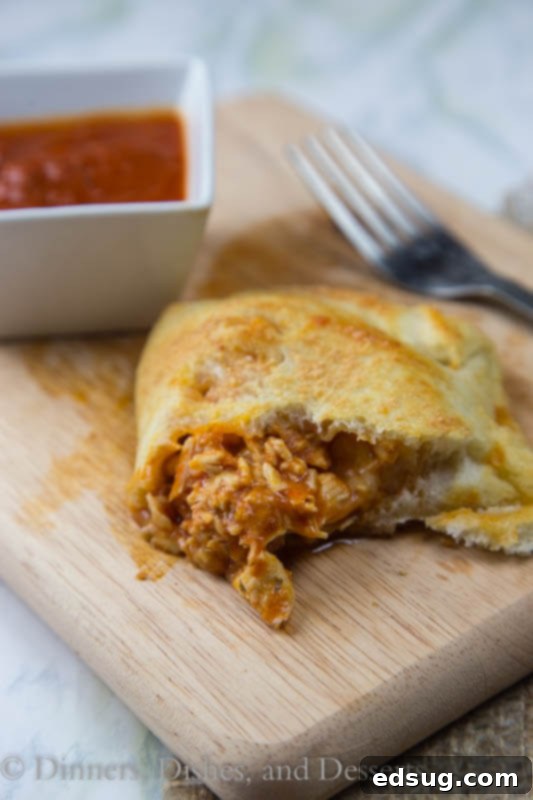 Ultimate Chicken Parmesan Calzones 4 chicken calzone on a plate