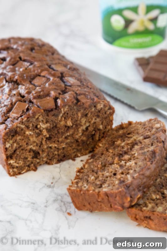 Irresistible Chocolate Chip Oatmeal Banana Bread 4 close up of chocolate oatmeal banana bread, showing melted chocolate and oat texture