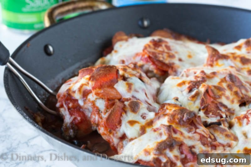 Ingredients for One Pan Pizza Chicken laid out on a wooden cutting board