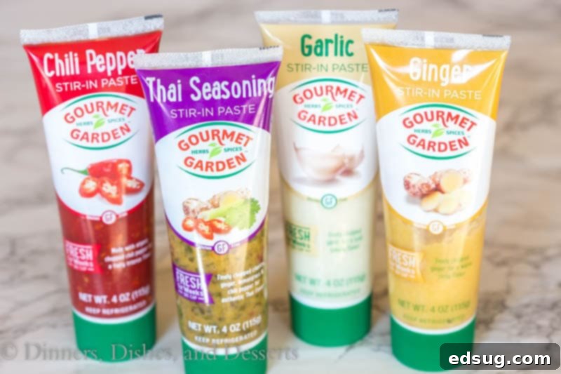 Fiery Thai Chicken Noodles 4 Assortment of Gourmet Garden herbs and spices laid out on a cutting board, ready for use in spicy Thai noodles.