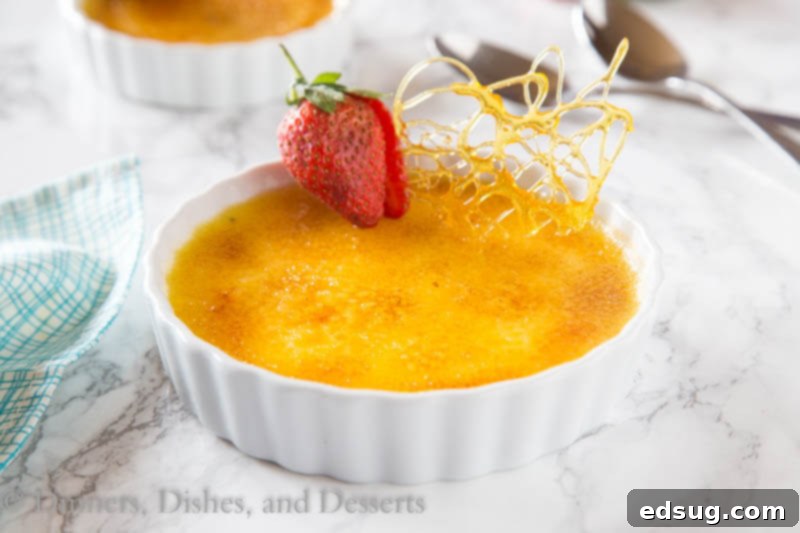 Caramelized Custard Delight 3 Two ramekins of homemade creme brulee with golden caramelized tops