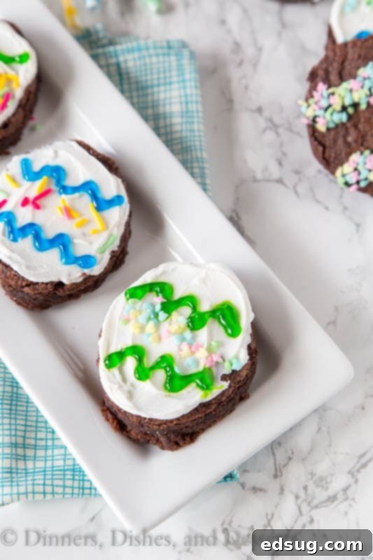 A selection of decorated Easter egg brownies showcasing various colorful designs.