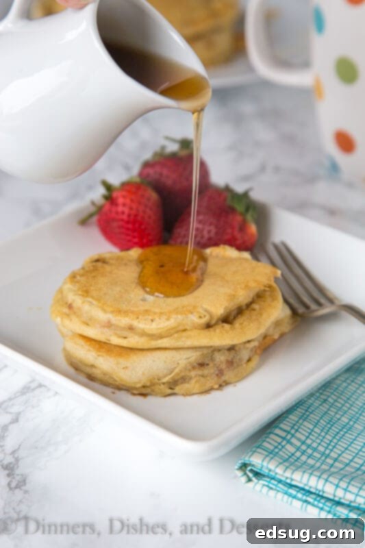 Savory Sausage Pancakes 3 sausage pancakes on a plate