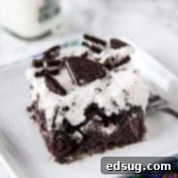 Oreo Poke Cake - An easy chocolate cake topped with an Oreo pudding and whipped cream mixture. Light, creamy, and so good!
