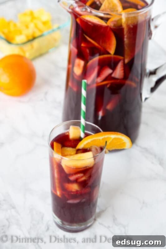 Pitcher of easy sangria chilling with fresh fruit