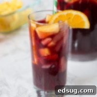 This Easy Sangria Recipe is perfect for any gathering, featuring sweet and fruity flavors ideal for a hot day. Make a pitcher and invite friends over!