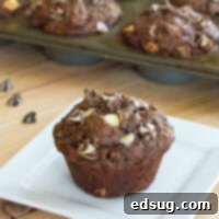 Chocolate Banana White Chocolate Chip Muffins - Moist and tender chocolate and banana muffins with lots of white chocolate chips.