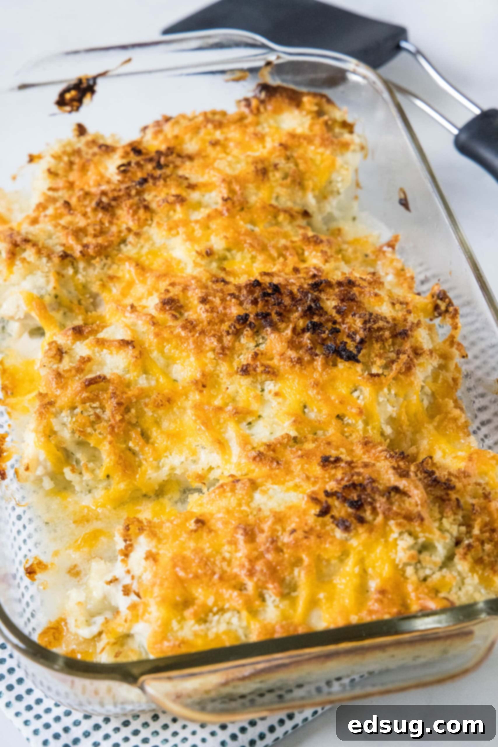 Baked ranch chicken in a glass casserole dish.