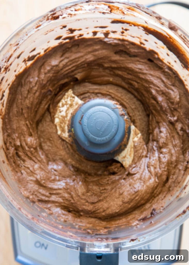 Velvet Chocolate Indulgence 4 The smooth, rich chocolate mousse mixture in a food processor, perfectly blended and ready for chilling.