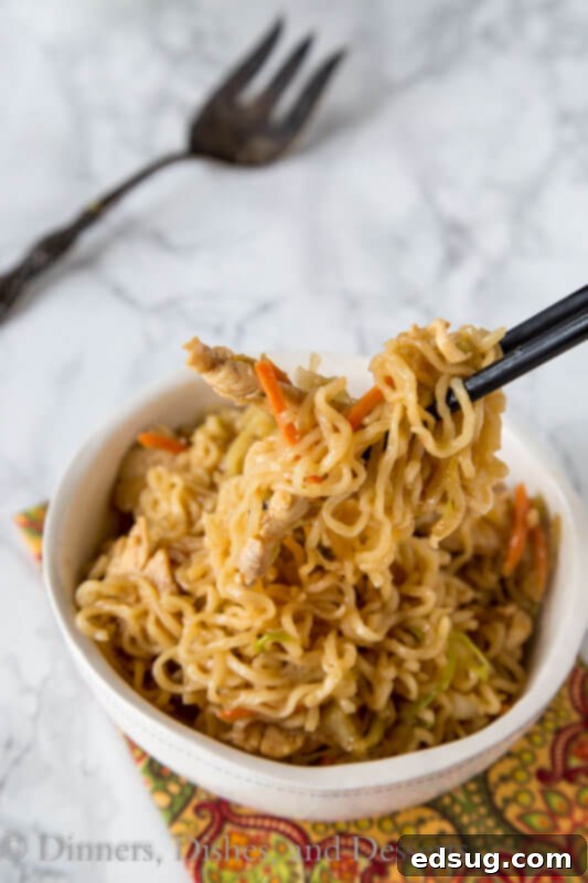 Ultimate Chicken Chow Mein 4 A bowl of food on a plate, with Noodle and Chow mein