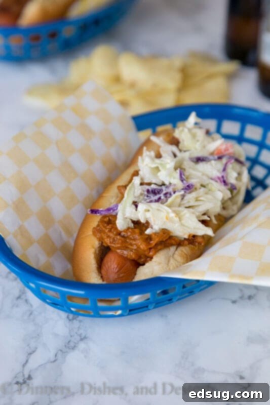 Loaded BBQ Pulled Pork Dogs 5 barbecue pulled pork hot dogs on a plate with fresh ingredients