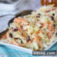 Cranberry Apple Coleslaw - an easy coleslaw recipe that you can make ahead of time, and bring to any summer get together. Or serve at home with just about anything!