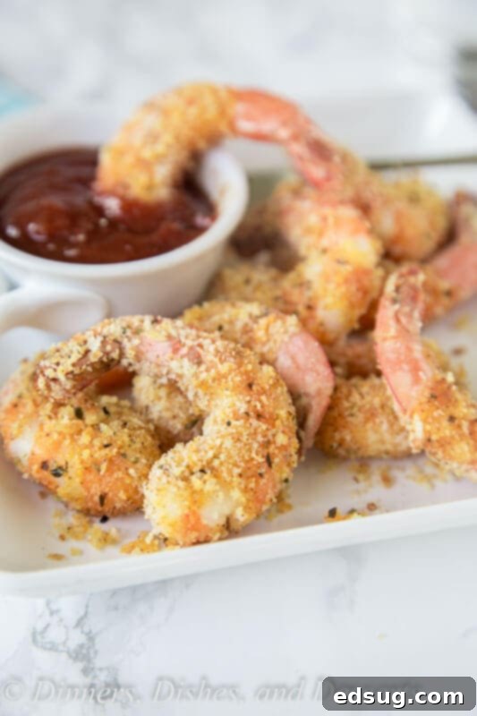 plate of crispy oven fried shrimp with dipping sauce