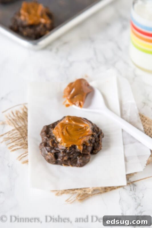 A selection of freshly made Dulce de Leche No Bake Cookies on a rustic wooden surface.