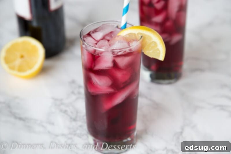 Wine Spritzer - use red win to make a cool and refreshing cocktail you can enjoy anytime of day! So easy, you can make in minutes, with just 2 ingredients!