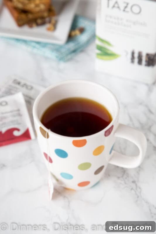 A close-up of a cup of Tazo tea, steaming gently, ready to be enjoyed