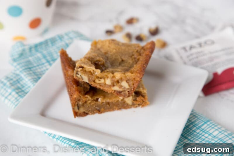 Freshly baked Walnut Blondies arranged beautifully on a serving plate, ready to be enjoyed