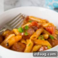 One Pan Cheesy Sausage Pasta - get dinner on the table with these easy pasta recipe. Just one pan, 20 minutes, and you are done!