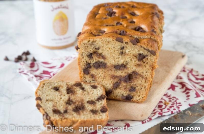 Peanut Butter Chocolate Chip Loaf 3 Close-up of freshly sliced peanut butter chocolate chip bread on a wooden board