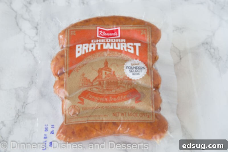 Loaded Cheddar Brat Dip 4 Fresh Klement's Cheddar Bratwursts in a clear vacuum-sealed package, showcasing their quality