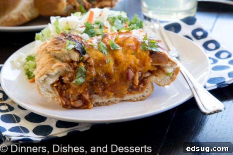 Cheesy BBQ Chicken French Bread Boats 3 barbecue chicken stuffed french bread on a plate