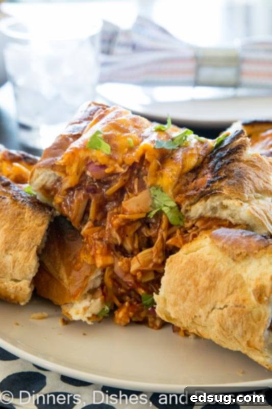 Cheesy BBQ Chicken French Bread Boats 4 barbecue chicken stuffed french bread on a plate