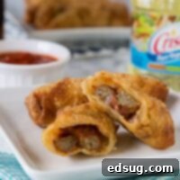 Meatball Sub Egg Rolls - all the flavors of your favorite meatball sub sandwich in a crispy egg roll. Serve with marinara sauce for dipping and you have the perfect appetizer or snack!
