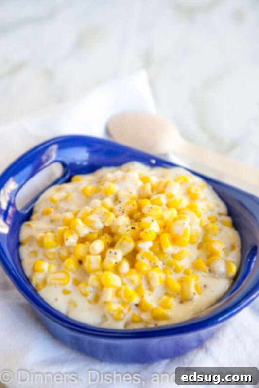 Velvety Slow Cooker Cream Corn 2 A bowl of corn in a blue dish
