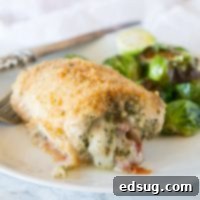 Italian Stuffed Chicken - chicken breasts rolled up with pesto, tomatoes, and cheese! Then baked until crispy and delicious, a great family dinner.