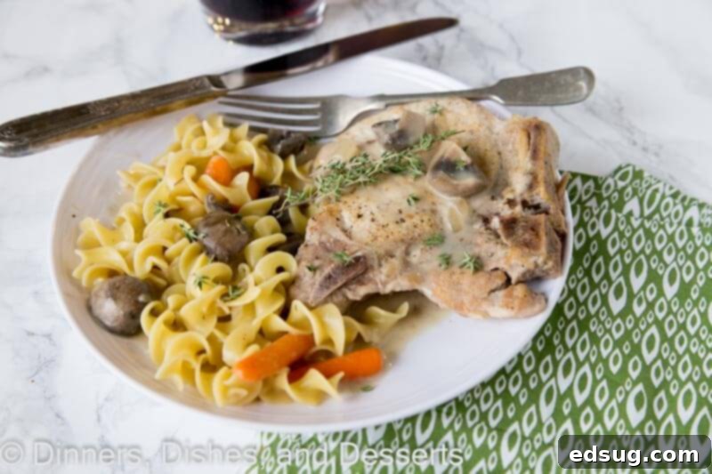 Close-up of ingredients for slow cooker pork chops, including fresh vegetables, herbs, and seasonings.