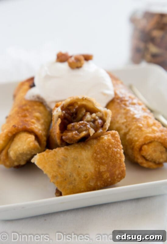 pecan pie eggrolls on a plate with whipped cream