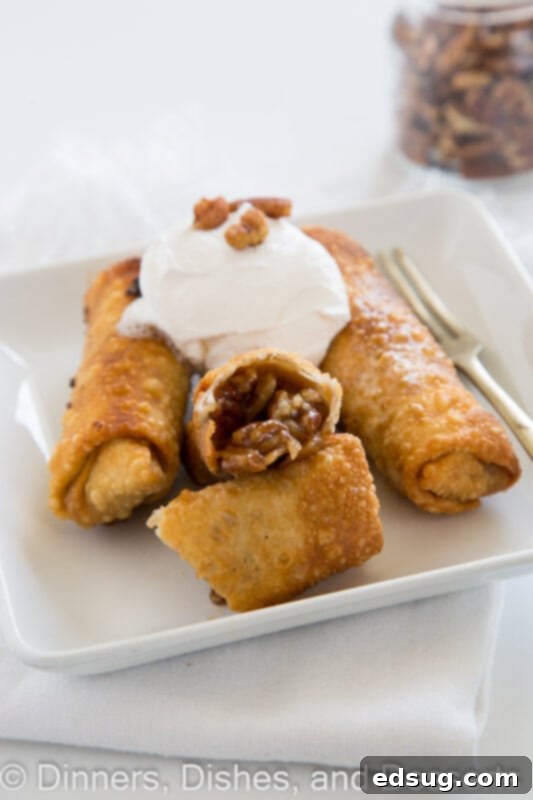 pecan pie eggrolls on a plate with fresh pecans