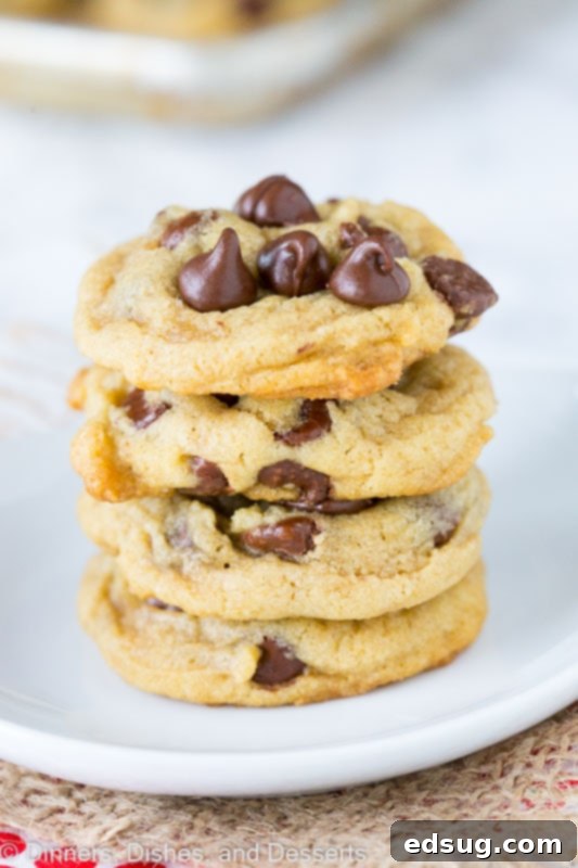 Close-up of golden brown chocolate chip cookies on a wooden table