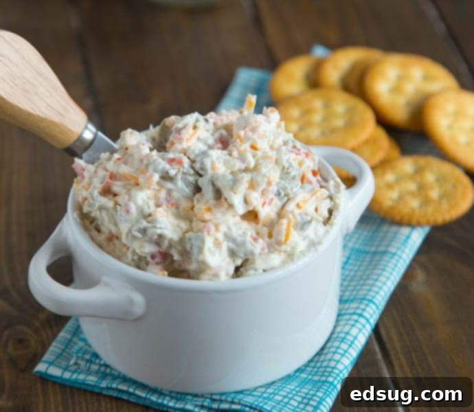 Kickoff Comfort Food 10 Cheddar Green Olive Dip, creamy and savory, in a serving bowl