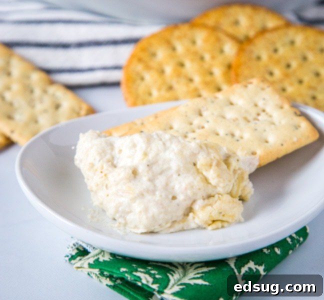 Kickoff Comfort Food 11 Hot Artichoke Dip, creamy, cheesy, and golden brown in a baking dish
