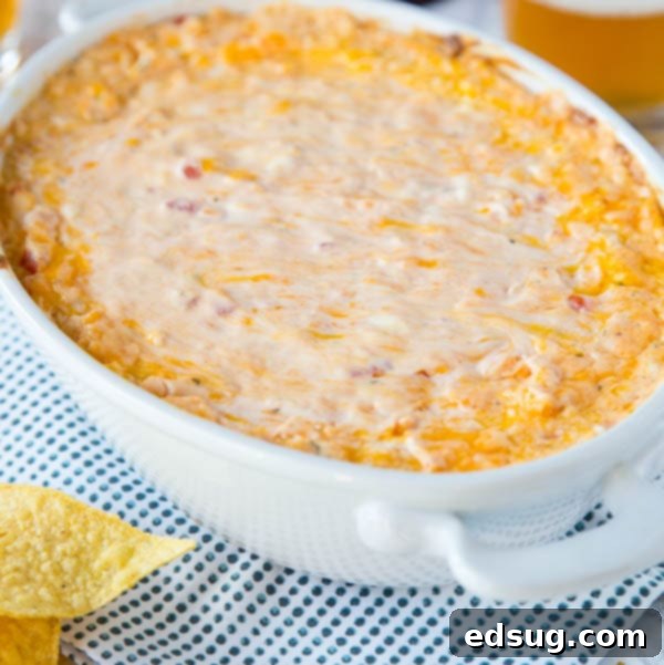 Kickoff Comfort Food 3 Baked cheese dip with melted cheese and spices in a dish, ready to be served