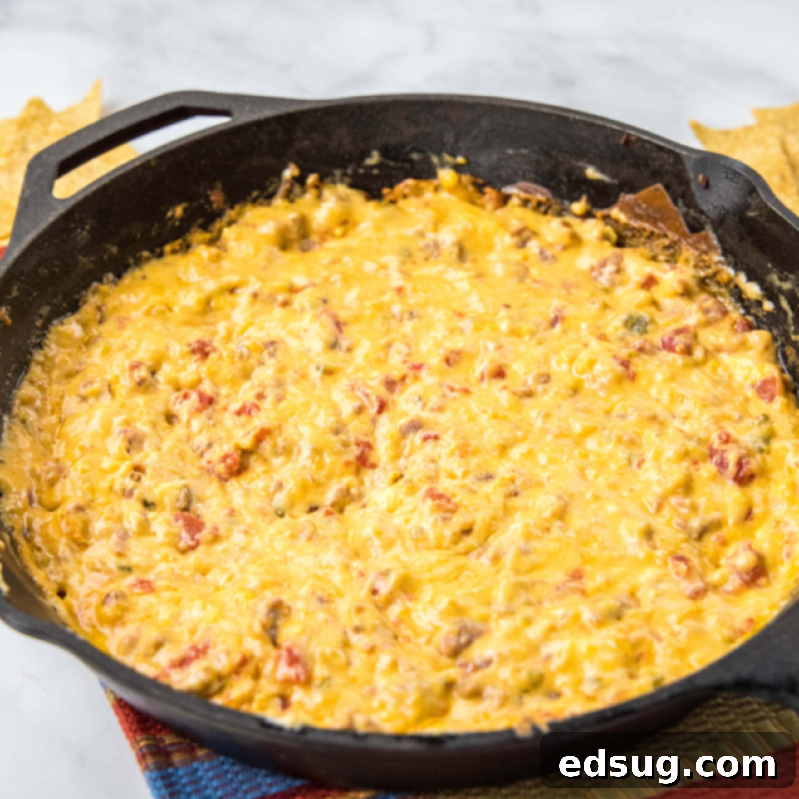 Kickoff Comfort Food 23 Close up of hot Smoked Queso, rich and cheesy, in a bowl